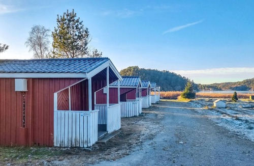 Stromstad O House | Nice small wooden cottage on natural plot by the sea fjord.