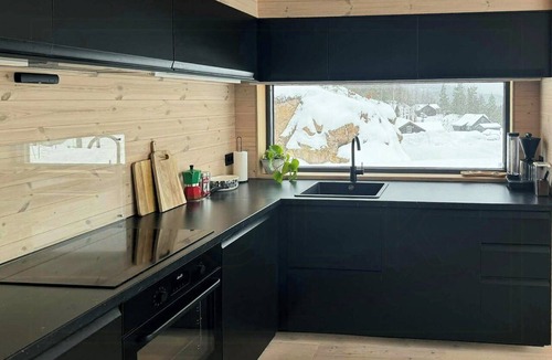 Hennseid House | Nordic design cabin with a view over Lake Toke