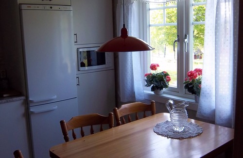Savsjo House | Outdoor place with furniture and barbeque, boat in lake