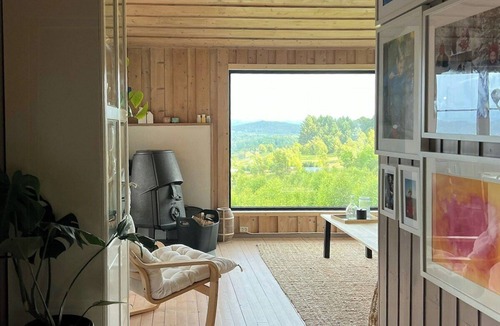 Sveio House | Panoramic cabin with forest and mountain views