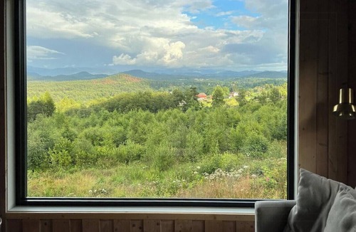 Sveio House | Panoramic cabin with forest and mountain views