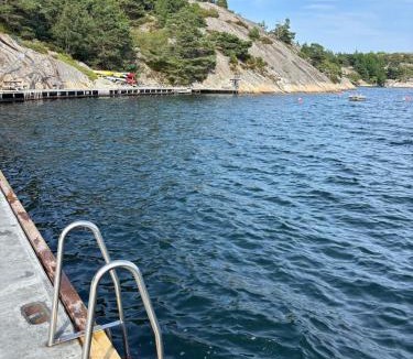 Tregde House | Peaceful seaside cabin with guest house - large private outdoor areas and boat available on request