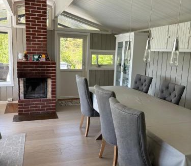 Tregde House | Peaceful seaside cabin with guest house - large private outdoor areas and boat available on request