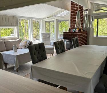 Tregde House | Peaceful seaside cabin with guest house - large private outdoor areas and boat available on request