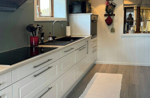 Arendal House | Red country house with lush gardens near Arendal