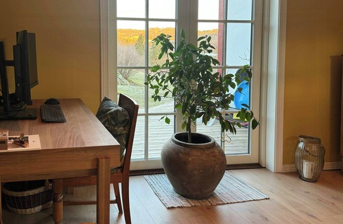 Arendal House | Red country house with lush gardens near Arendal