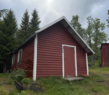 Skanland House | Rustic Cabin in Nature Outhouse & Wood Stove