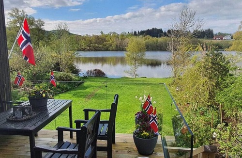 Sandnes Villa | Scenic Lakeside Residence with Spacious Outdoor Living