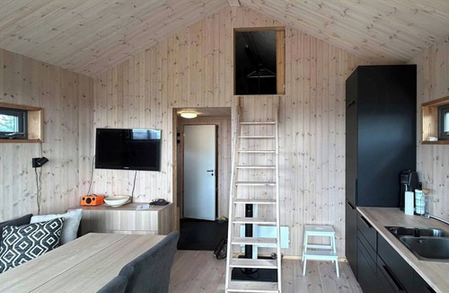 Vestre Slidre House | Small mountain cabin in pastoral area by Syndin
