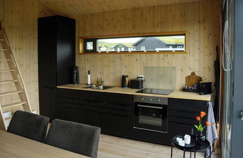 Vestre Slidre House | Small mountain cabin in pastoral area by Syndin