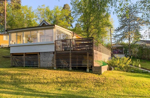 Sodertalje House | Spend an unforgettable vacation near the lake in this inviting vacation home.