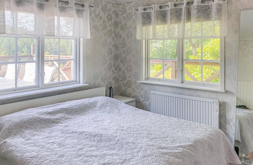 Harryda Municipality House | Spend an unforgettable vacation near the lake in this inviting vacation home.