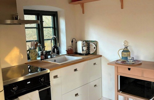 Trelleborg House | Stone house with thatched roof on 1750s farm