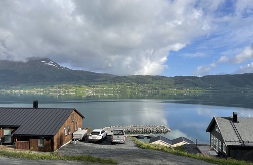 Gjemnes Municipality House | Stunning house on the fjord with panoramic views, a fireplace, and a boat—near the Atlantic Road