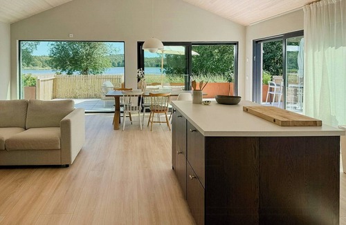 Stromstad House | Sunlit coastal cottage with a grand terrace