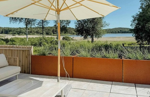Stromstad House | Sunlit coastal cottage with a grand terrace