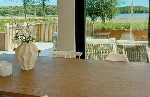 Stromstad House | Sunlit coastal cottage with a grand terrace