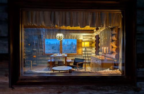 Rovaniemi Ski Chalet | Suvantokoto Riverside Log Cabin