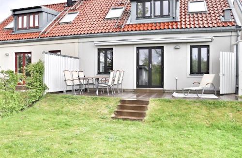 Lervik House | Terrace with Awning Pool & Tennis Fireplace