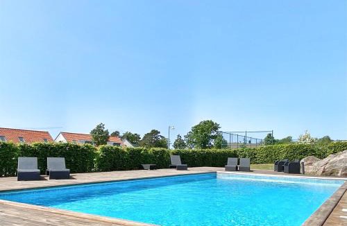 Lervik House | Terrace with Awning Pool & Tennis Fireplace