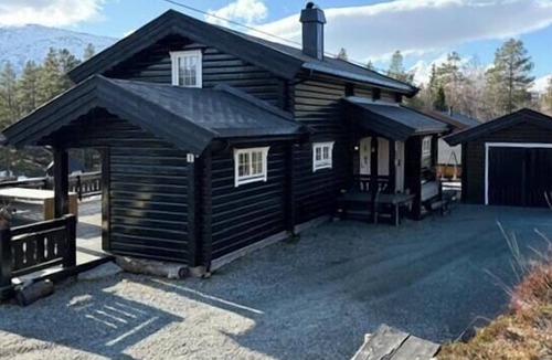 Bjorli House | Timber cabin with hot tub by ski tracks