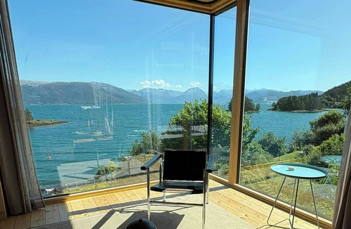 Strandebarm House | Timber cabin with private jetty by Hardangerfjord
