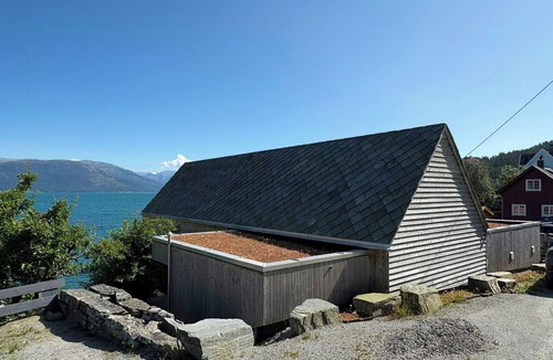 Strandebarm House | Timber cabin with private jetty by Hardangerfjord