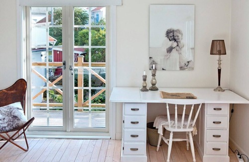 Klaedesholmen House | White wooden house on island's most charming alley