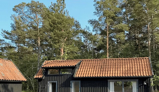 Bright house with sunset over Ekeviken on Fårö