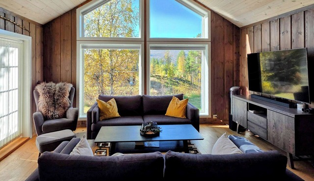 Cabin by Otra with fire pit near Hovden