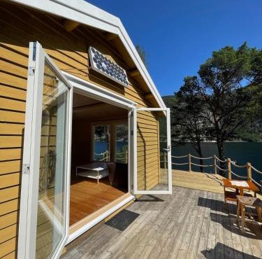 Cabin with boat close to the sea, Hitra municipality
