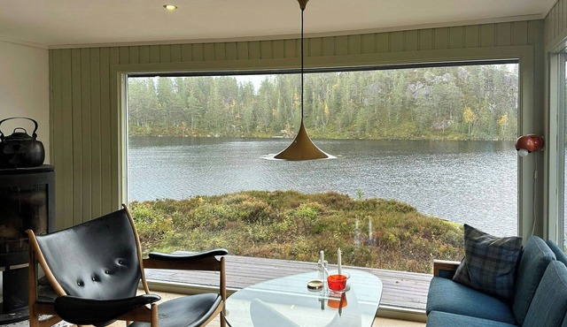 Design cabin by mountain lake in Rukkedalen