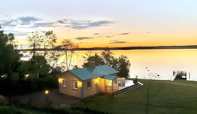 Exclusive beach cottage with a private beach, dock, and garden