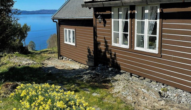 Historic farm with sea view over Bjørnefjorden
