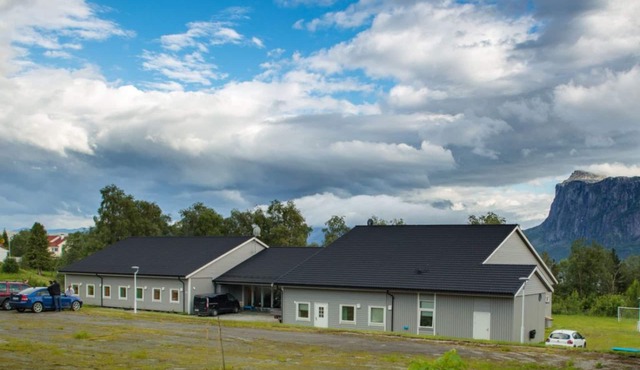 Hostel in a rural area surrounded by mountains and fjord
