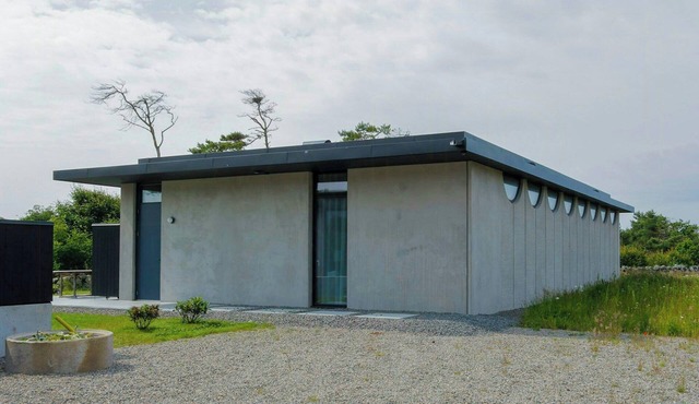 Modern concrete house near Glommen beach