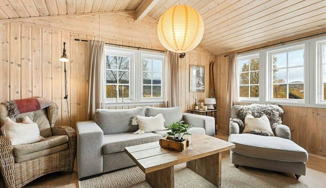 Modernized cabin near ski slopes with deck views