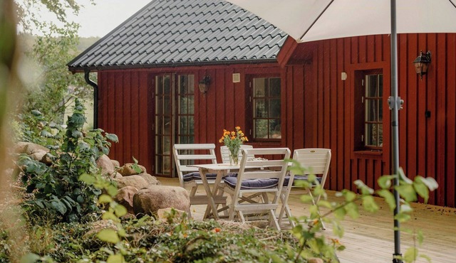 Quaint barn nestled between sea and forest