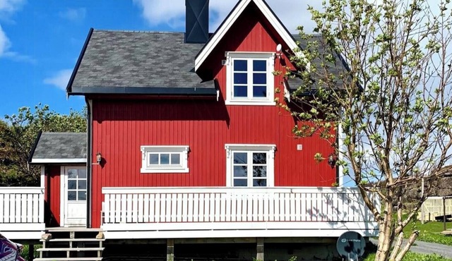 Red cottage by the sea in Laukvika