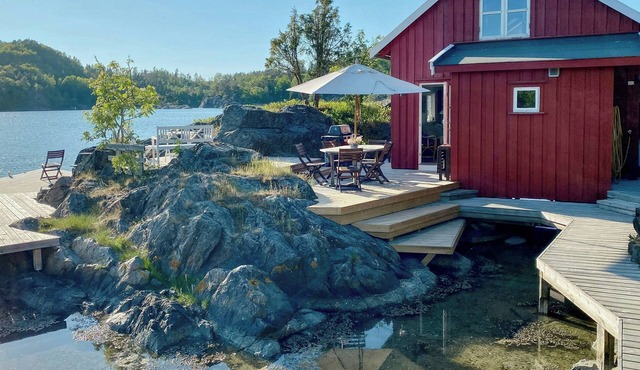 Renovated boathouse from 1960 by the sea in Borøya