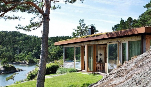 Spacious cabin with dock and beach near Søgne