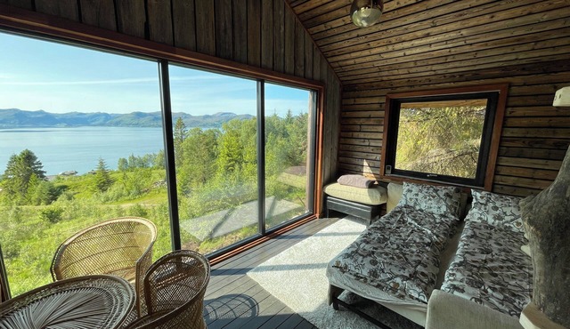 Stunning fiord panorama view off-grid forest cabin