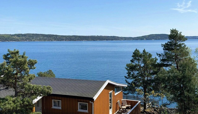 Summer cabin with sunrise over Oslo Fjord