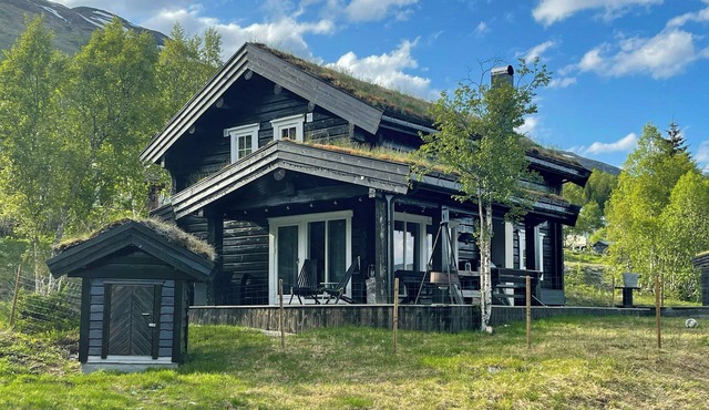 Timber cabin with outdoor spa near Stranda
