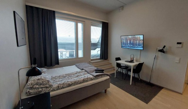 Top location city center studio with balcony and free parking Kotimaailma Apartments