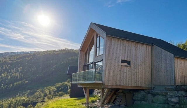 Vidsyn Hodlekve: Panoramic views, playful modern design, cinema & foosball