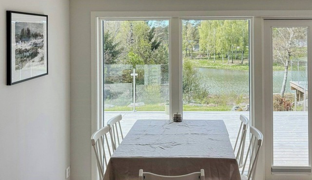 Waterfront cottage in forest and sea harmony