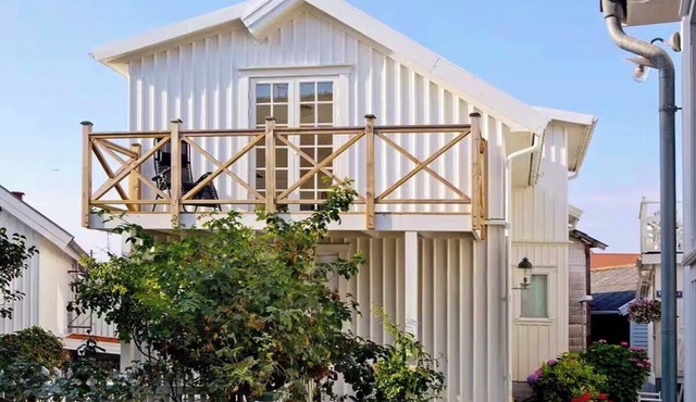 White wooden house on island's most charming alley