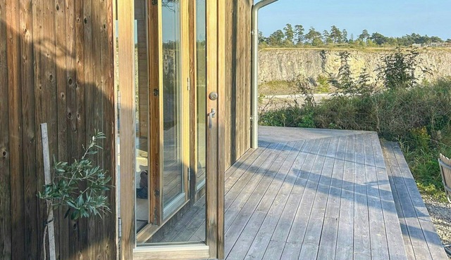 Wooden cottages by quarry with views