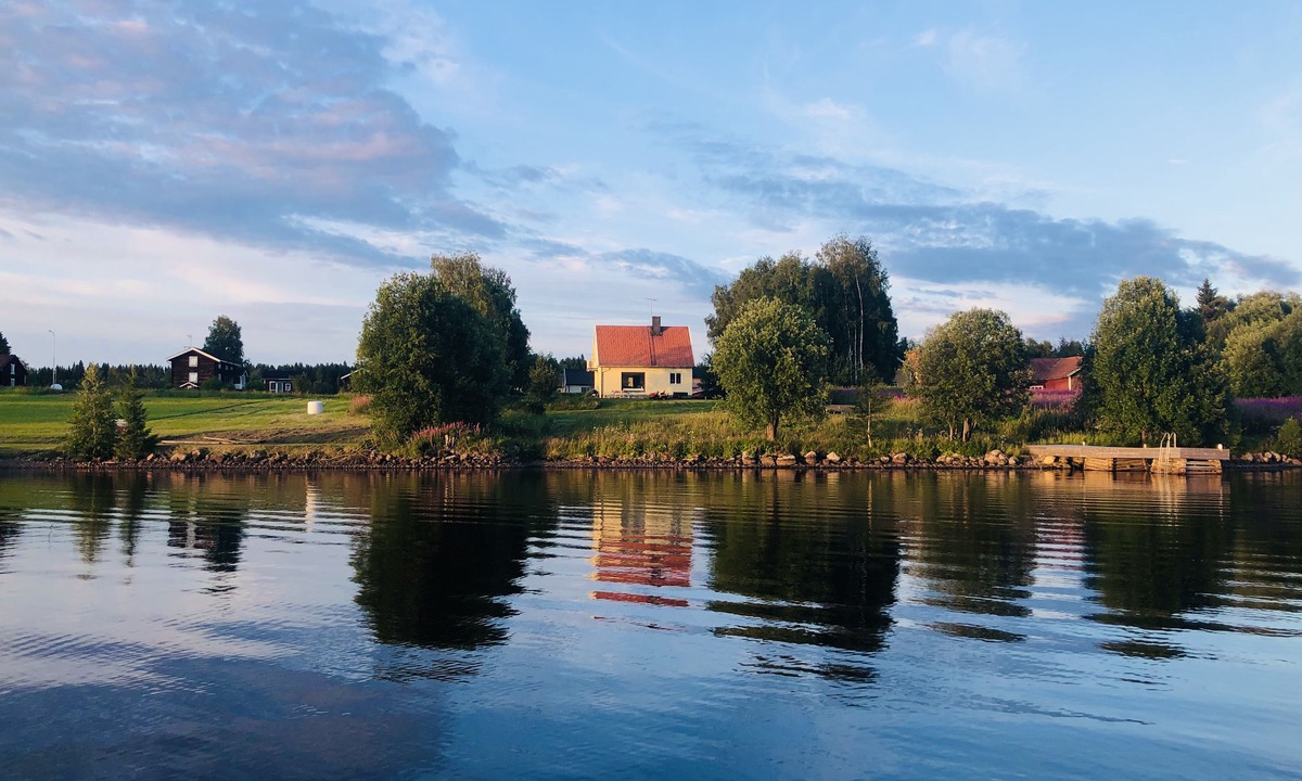 Ratan House | Lakefront house with a sauna, private dock, and rowboat
